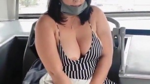 Milf with vibrator on the bus