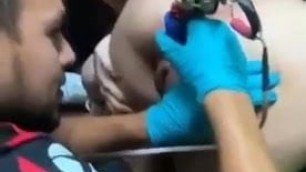 Getting her asshole tattoed