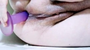 Grandma takes dildo deep in her ass