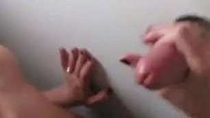 Hot young wife sucks off a stranger in a real gloryhole