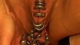 Heavy pierced pussy with heavy weights hanging