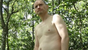 Kudoslong is outside in the woods in just a grey t-shirt and black boxer briefs strips and wanks